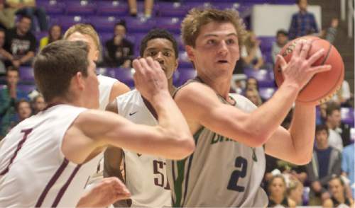 Rick Egan  |  The Salt Lake Tribune

Lone Peak guard Tyson Doman (1) guards Copper Hills guard  Trevor Hoffman (2), in 5A Boys Basketball StateTournament action, Lone Peak vs Copper Hills, at the Dee Event Center, Monday, February 23, 2015