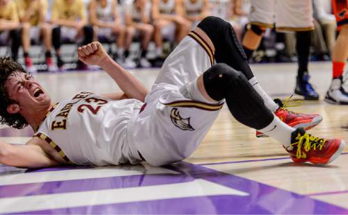 Trent Nelson  |  The Salt Lake Tribune
Maple Mountain's Kade Poulsen (23) crashes to the floor as Maple Mountain faces Mountain Crest High School in the state 4A boys basketball tournament at the Dee Events Center in Ogden, Tuesday February 24, 2015.