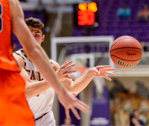 Trent Nelson  |  The Salt Lake Tribune
Maple Mountain's Jake Dixon (4) passes the ball as Maple Mountain faces Mountain Crest High School in the state 4A boys basketball tournament at the Dee Events Center in Ogden, Tuesday February 24, 2015.