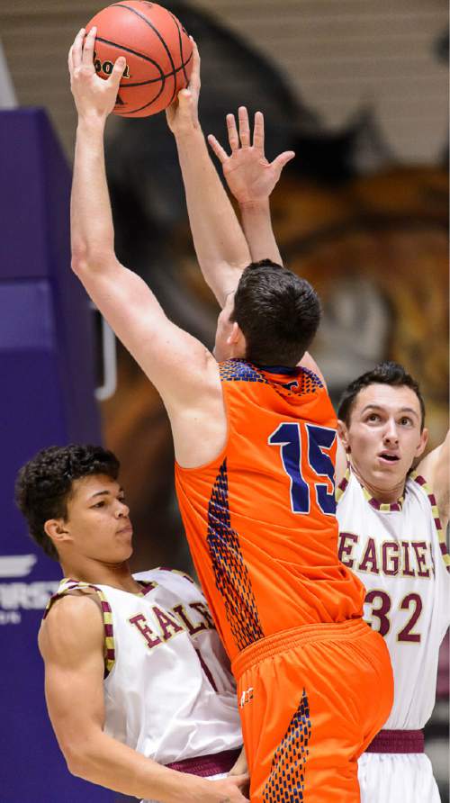 Trent Nelson  |  The Salt Lake Tribune
Maple Mountain's Jaren Hall (1) takes the charge from Mountain Crest's Jonathan Huff (15), as Maple Mountain faces Mountain Crest High School in the state 4A boys basketball tournament at the Dee Events Center in Ogden, Tuesday February 24, 2015. Maple Mountain's Bryson Anderson (32) at right.