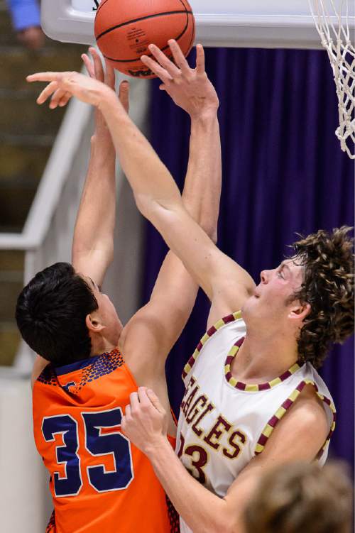 Trent Nelson  |  The Salt Lake Tribune
Mountain Crest's Sherman Barnes (35) puts up a shot with Maple Mountain's Kade Poulsen (23) defending, as Maple Mountain faces Mountain Crest High School in the state 4A boys basketball tournament at the Dee Events Center in Ogden, Tuesday February 24, 2015.