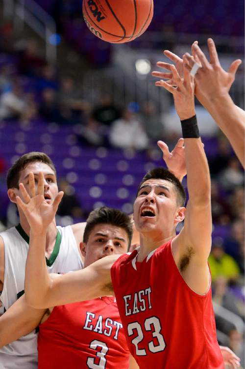 Trent Nelson  |  The Salt Lake Tribune
East's Dacian Spotted Elk reaches for a loose ball as East faces Olympus High School in the state 4A boys basketball tournament at the Dee Events Center in Ogden, Tuesday February 24, 2015.