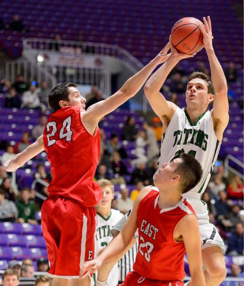Trent Nelson  |  The Salt Lake Tribune
Olympus' Jake Lindsey (21) puts up a shot, defended by East's Ryan Hurlburt (24), as East faces Olympus High School in the state 4A boys basketball tournament at the Dee Events Center in Ogden, Tuesday February 24, 2015.