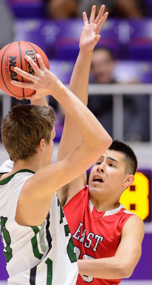 Trent Nelson  |  The Salt Lake Tribune
East's Dacian Spotted Elk defending Olympus' Isaac Monson (20), as East faces Olympus High School in the state 4A boys basketball tournament at the Dee Events Center in Ogden, Tuesday February 24, 2015.