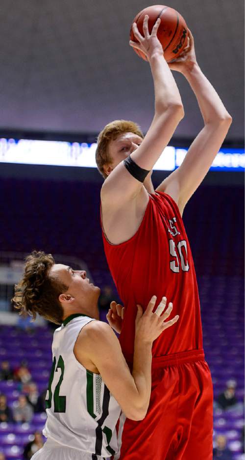 Trent Nelson  |  The Salt Lake Tribune
East's Mark Jackson (50) pulls down a rebound over Olympus' Nick Wright (32) as East faces Olympus High School in the state 4A boys basketball tournament at the Dee Events Center in Ogden, Tuesday February 24, 2015.