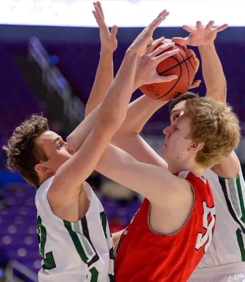 Trent Nelson  |  The Salt Lake Tribune
East's Mark Jackson (50) is double-teamed by Olympus' Nick Wright (32) and Olympus' Jake Lindsey (21), as East faces Olympus High School in the state 4A boys basketball tournament at the Dee Events Center in Ogden, Tuesday February 24, 2015.