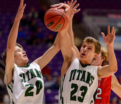 Trent Nelson  |  The Salt Lake Tribune
Olympus' Isaac Monson (20) and Olympus' Miles Keller (23) pull down a rebound ahead of East's Blake Hansen (32) as East faces Olympus High School in the state 4A boys basketball tournament at the Dee Events Center in Ogden, Tuesday February 24, 2015.