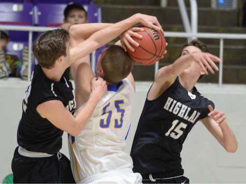 Steve Griffin  |  The Salt Lake Tribune

Highland's Maxwell Wilson (22) and teammate Rick Schmidt (15) team up to block the shot of Orem's Richard Harward (55) during opening round of the boy's 4A basketball state tournament game at the Dee Event Center in Ogden, Tuesday, February 24, 2015.