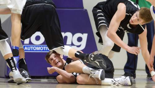 Steve Griffin  |  The Salt Lake Tribune

Highland's Ryan Lambson (2) covers up for safety after being knocked down in the lane during opening round of the boy's 4A basketball state tournament game against Orem at the Dee Event Center in Ogden, Tuesday, February 24, 2015.