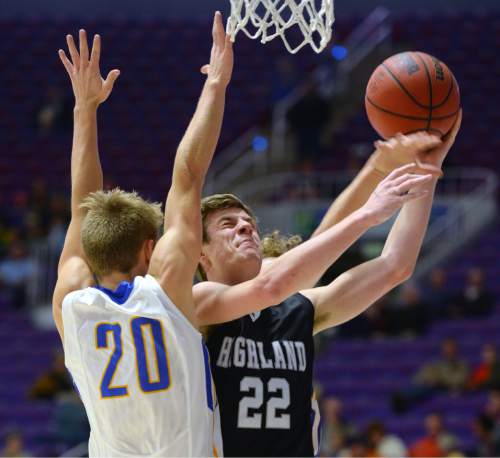 Steve Griffin  |  The Salt Lake Tribune

Highland's Maxwell Wilson (22) gets fouled as he gets past Orem's Kyler Anderson (20) during opening round of the boy's 4A basketball state tournament game at the Dee Event Center in Ogden, Tuesday, February 24, 2015.