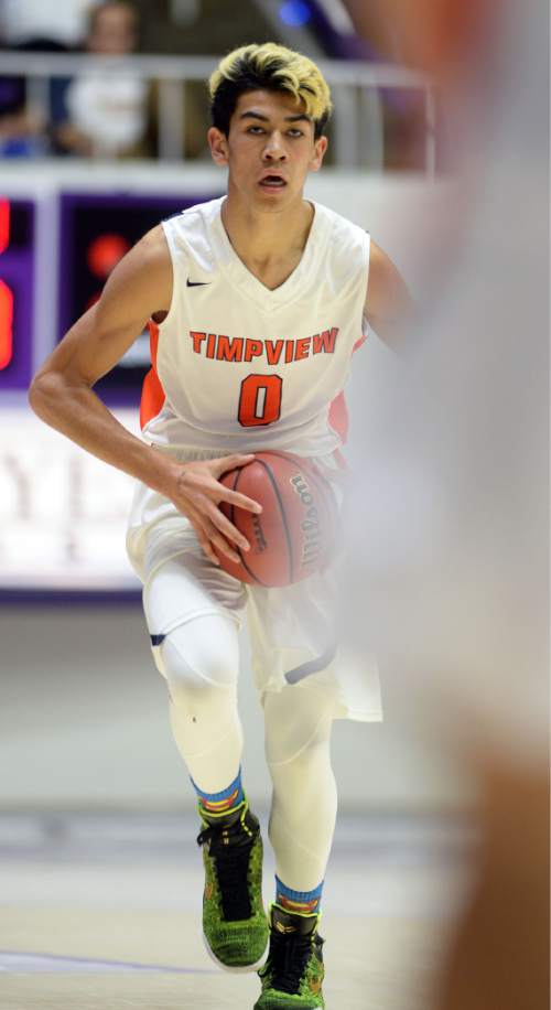 Steve Griffin  |  The Salt Lake Tribune

TImpview's Samson Nacua brings the ball up court during opening round of the boy's 4A basketball state tournament game against Sky View at the Dee Event Center in Ogden, Tuesday, February 24, 2015.