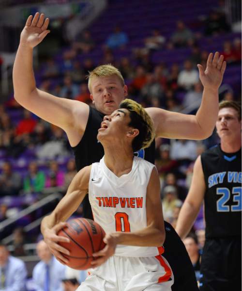 Steve Griffin  |  The Salt Lake Tribune

Timpview's Samson Nacua looks up at the basket as Sky View's Tyler Downs plays defense during opening round of the boy's 4A basketball state tournament game at the Dee Event Center in Ogden, Tuesday, February 24, 2015.