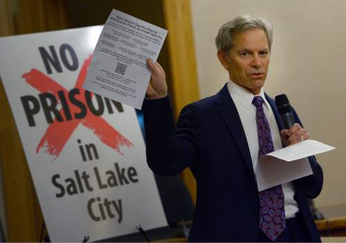 Leah Hogsten  |  The Salt Lake Tribune
Mayor Ralph Becker holds a handout to attendees outlining the "Top Five Ways to Help Keep the Prison out of Salt Lake City." Salt Lake City residents express their concerns about the prison relocation to Mayor Ralph Becker and other legislators, Tuesday, December 16, 2014 at the City and County Building.