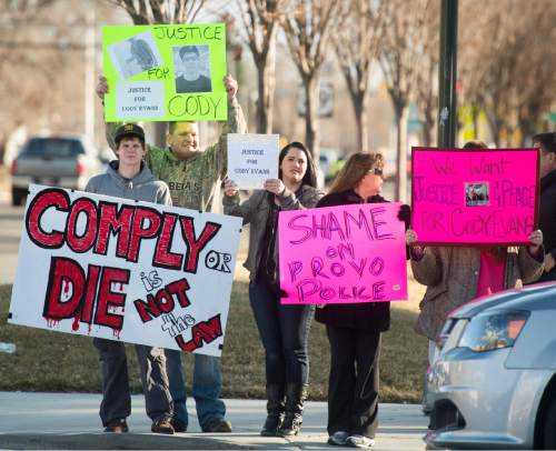 Rick Egan  |  The Salt Lake Tribune

Supporters of Cody Evans hold signs at the corner of 500 West and Center street, during a rally in Provo, Wednesday, February 25, 2015