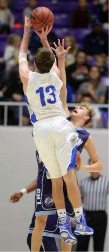 Steve Griffin  |  The Salt Lake Tribune

Bingham's Kyle Gearig (13) shoots a three over Layton's Dallin Watts during quarterfinals of the boy's 5A basketball state tournament game at the Dee Event Center in Ogden, Wednesday, February 25, 2015.