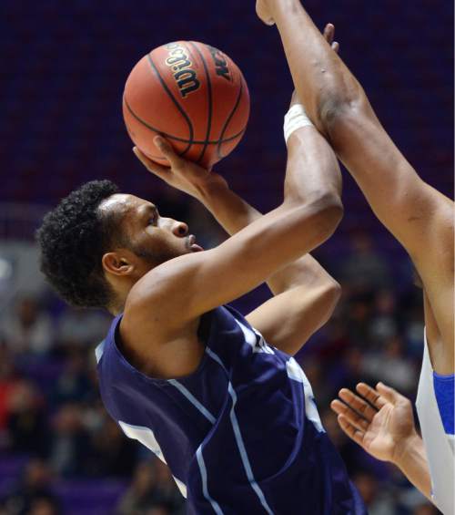 Steve Griffin  |  The Salt Lake Tribune

Layton's Jarriesse Blackmon drives against Bingham's Yoeli Libii (22) during quarterfinals of the boy's 5A basketball state tournament game at the Dee Event Center in Ogden, Wednesday, February 25, 2015.