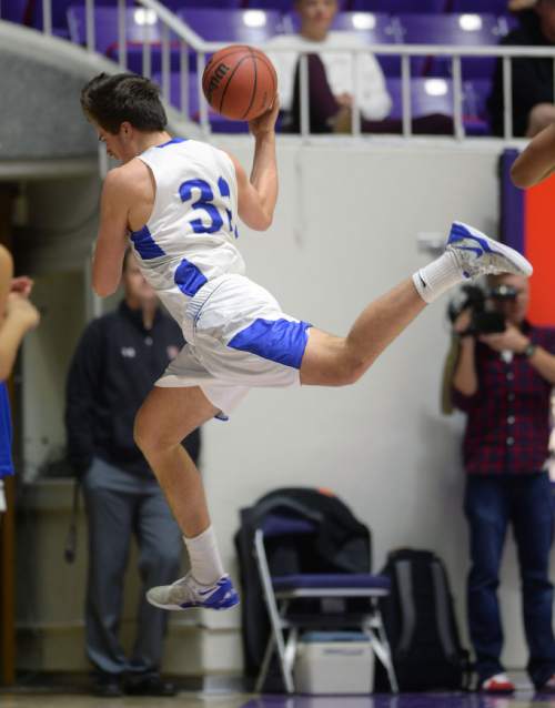 Steve Griffin  |  The Salt Lake Tribune

Bingham's Josh Newbold (32) leaps out of bounds as he tries to save the ball during quarterfinals of the boy's 5A basketball state tournament game between against  Layton at the Dee Event Center in Ogden, Wednesday, February 25, 2015.