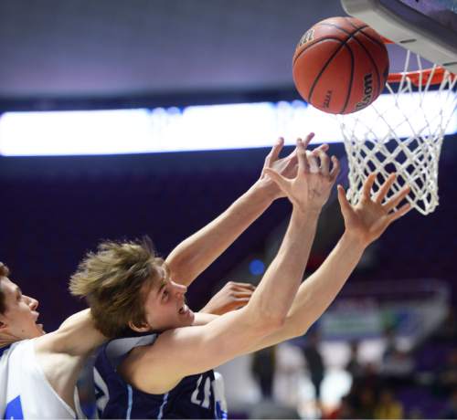 Steve Griffin  |  The Salt Lake Tribune

Bingham's Jared Holman (24) and Layton's Cody Edwards reach for a rebound during quarterfinals of the boy's 5A basketball state tournament game at the Dee Event Center in Ogden, Wednesday, February 25, 2015.