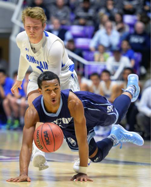 Steve Griffin  |  The Salt Lake Tribune

Layton's Julian Blackmon dives for the ball ahead of Bingham's MIchael Green (15)  during quarterfinals of the boy's 5A basketball state tournament game at the Dee Event Center in Ogden, Wednesday, February 25, 2015.