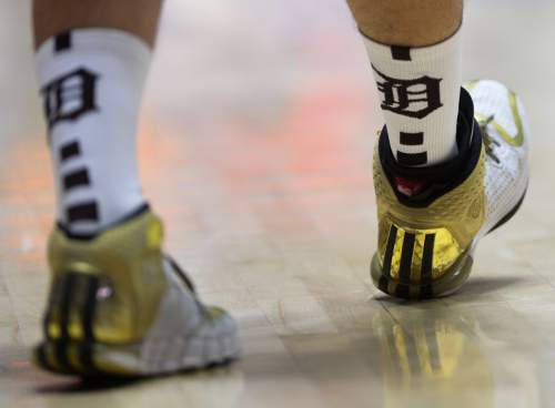 Steve Griffin  |  The Salt Lake Tribune

Davis's Tony Feick (5) shows his colors on his shoes during quarterfinals of the boy's 5A basketball state tournament game against Pleasant Grove at the Dee Event Center in Ogden, Wednesday, February 25, 2015.