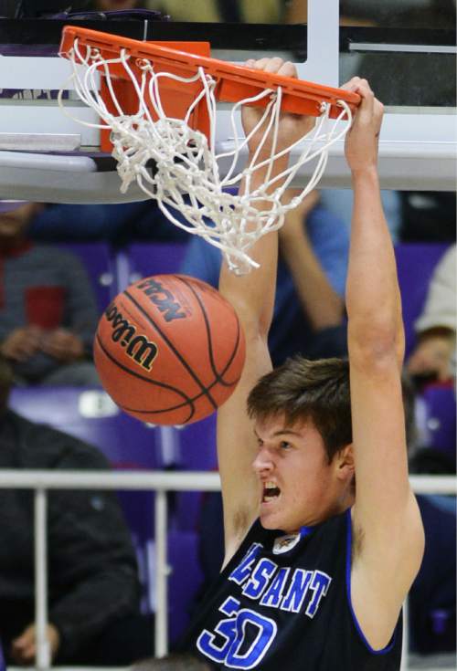Steve Griffin  |  The Salt Lake Tribune

Pleasant Grove's Brody Childs (30) hangs on the rim after throwing down a monster dunk during quarterfinals of the boy's 5A basketball state tournament game against Davis  at the Dee Event Center in Ogden, Wednesday, February 25, 2015.