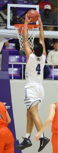 Steve Griffin  |  The Salt Lake Tribune

Hunter's Noah Togiai (4) throws down a dunk during quarterfinals of the boy's 5A basketball state tournament game against Brighton at the Dee Event Center in Ogden, Wednesday, February 25, 2015.