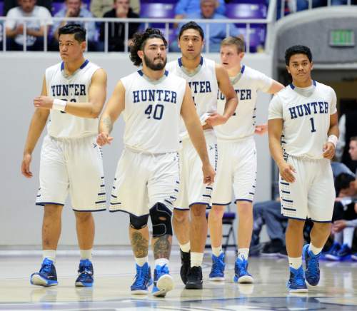 Steve Griffin  |  The Salt Lake Tribune

The Hunter starters take the court at the start of the third quarter during quarterfinals of the boy's 5A basketball state tournament game against  Brighton at the Dee Event Center in Ogden, Wednesday, February 25, 2015.