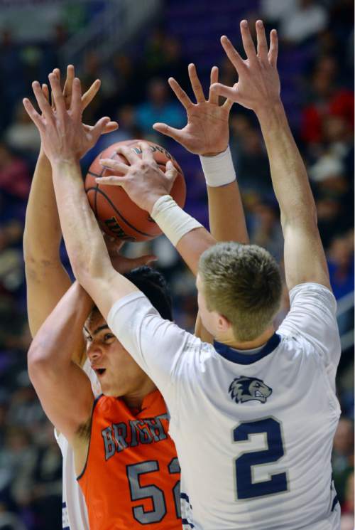 Steve Griffin  |  The Salt Lake Tribune

Brighton's Osa Masina gets smothered by the Hunter defense during quarterfinals of the boy's 5A basketball state tournament game at the Dee Event Center in Ogden, Wednesday, February 25, 2015.