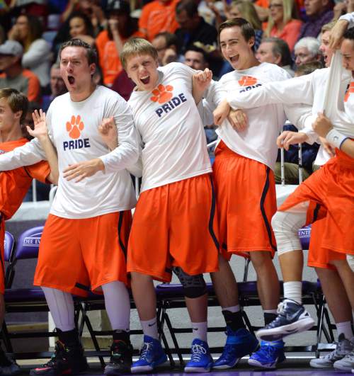 Steve Griffin  |  The Salt Lake Tribune

The Brighton bench reacts after Brighton's John Gremillion (32) throws down a dunk during quarterfinals of the boy's 5A basketball state tournament game against Hunter at the Dee Event Center in Ogden, Wednesday, February 25, 2015.