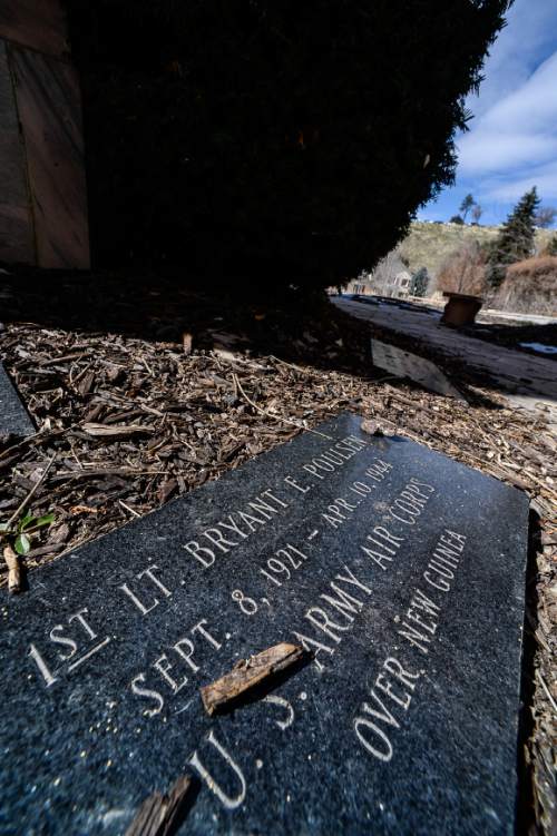 Francisco Kjolseth  |  The Salt Lake Tribune 
A small plaque in honor of World War II pilot Lt. Bryant E. Poulsen, lies in Memory Grove in Salt Lake. The remains of the pilot have been identified after being found in Papua New Guinea and will be buried in March in Arlington National Cemetery.