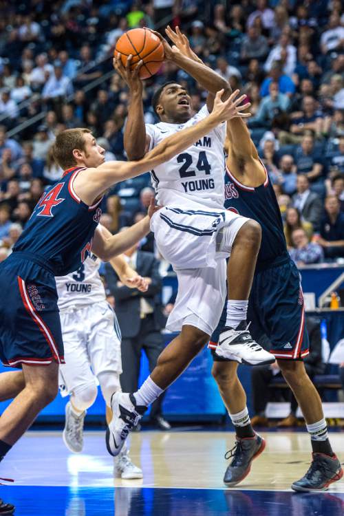 Chris Detrick  |  The Salt Lake Tribune
Brigham Young Cougars guard Frank Bartley IV (24) runs past St. Mary's Gaels forward Calvin Hermanson (24) and St. Mary's Gaels forward Garrett Jackson (22) during the game at the Marriott Center Thursday February 12, 2015. BYU won the game 82-60.