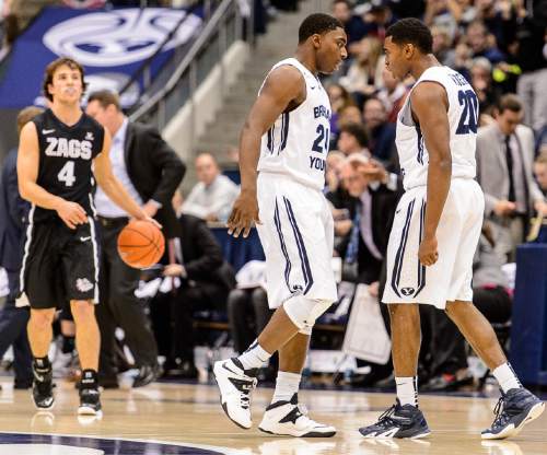 Trent Nelson  |  The Salt Lake Tribune
Brigham Young Cougars guard Frank Bartley IV (24) and guard Anson Winder (20) pump each other up during a first half comeback as BYU hosts Gonzaga, men's college basketball at the Marriott Center in Provo, Saturday December 27, 2014.