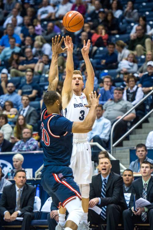 Chris Detrick  |  The Salt Lake Tribune
Brigham Young Cougars guard Tyler Haws (3) shoots over St. Mary's Gaels forward Desmond Simmons (30) during the game at the Marriott Center Thursday February 12, 2015. BYU won the game 82-60.