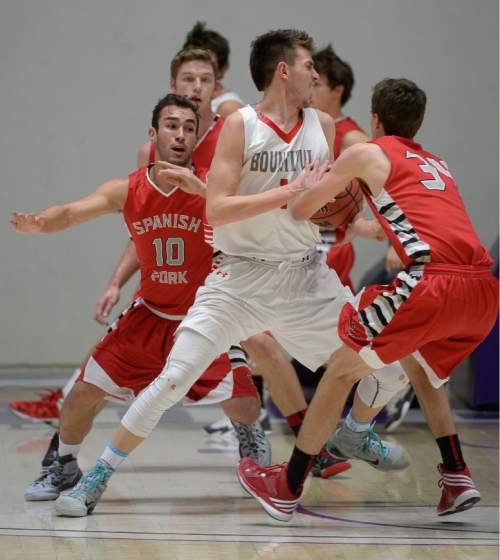 Francisco Kjolseth  |  The Salt Lake Tribune 
Bountiful's Zachary Seljaas (1)  tries to spin past the Bountiful defense in 4A boys' hoops quarterfinal at the Dee Events Center in Ogden on Thursday, Feb. 26, 2015.