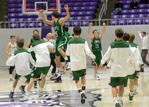 Francisco Kjolseth  |  The Salt Lake Tribune 
The Olympus bench erupts in celebration with their win over Maple Mountain in 4A boys' hoops quarterfinal at the Dee Events Center in Ogden on Thursday, Feb. 26, 2015.