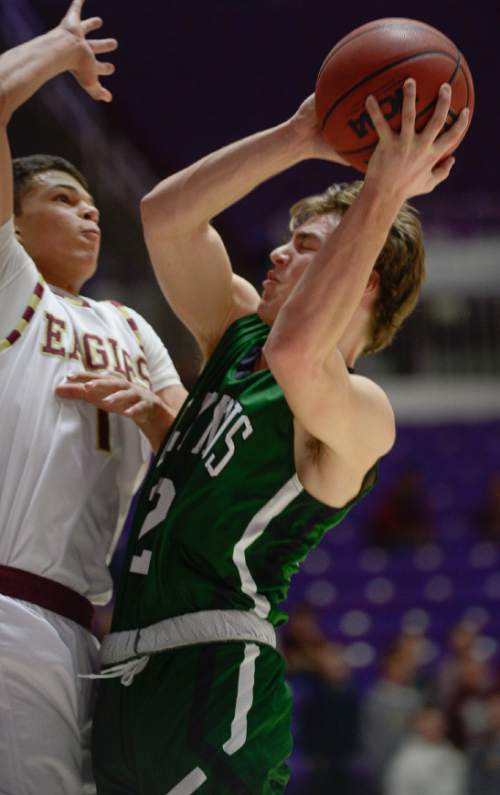 Francisco Kjolseth  |  The Salt Lake Tribune 
Olympus's Elias Falk (22) tries to push past Maple Mountain's Jaren Hall (1) on his way to the basket in 4A boys' hoops quarterfinal at the Dee Events Center in Ogden on Thursday, Feb. 26, 2015.
