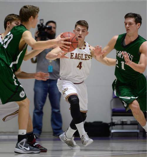 Francisco Kjolseth  |  The Salt Lake Tribune 
Maple Mountain's Jake Dixon (4) comes up the middle of Olympus in hopes of a steal in 4A boys' hoops quarterfinal at the Dee Events Center in Ogden on Thursday, Feb. 26, 2015.