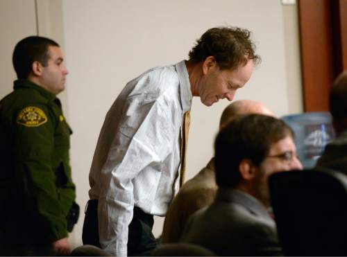 Al Hartmann  |  The Salt Lake Tribune
 Johnny Brickman Wall, left, sits with his defense team in 3rd District Court Thursday, Feb. 19, 2015, in Salt Lake City. Wall is accused of killing his former wife and researcher Uta von Schwedler in her Sugar House home in September 2011.