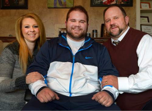 Leah Hogsten  |  The Salt Lake Tribune
Parents Jennifer and Stan Summers and their son Talan Summers (center) are happy to hear the "Right to Try" bill has passed in the Utah Legislature, Thursday, February 26, 2015.  Talan Summers, 23, has a rare disease called IGg4 systemic sclerosing disease, which is turning his tissues and organs hard inside. There is no cure, and the disease eventually will kill him."Right to Try"  legislation would allow dying patients to work with doctors, insurers and drug manufacturers to try experimental drugs that are early in the U.S. Food and Drug Administration's vetting process.