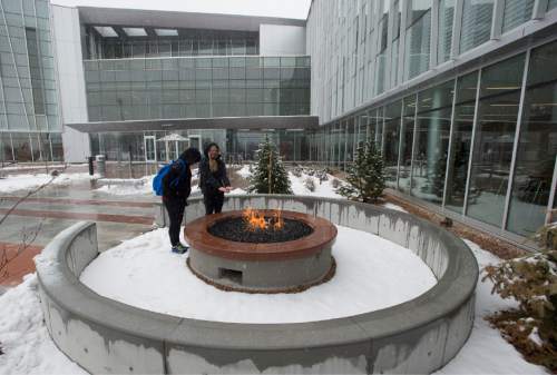 Rick Egan  |  The Salt Lake Tribune

Samantha Raisbeck and Hannah May warmed their hands in the fire pit, at the new George S. Eccles Student Life Center at the University of Utah, Thursday, February 26, 2015