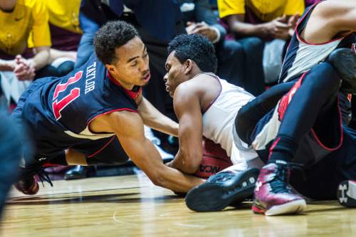 Chris Detrick  |  The Salt Lake Tribune
Utah Utes guard Brandon Taylor (11) and Arizona State Sun Devils guard Tra Holder (0) dive for the ball during the game at the Huntsman Center Thursday February 26, 2015.  Utah is winning 41-9 at halftime.