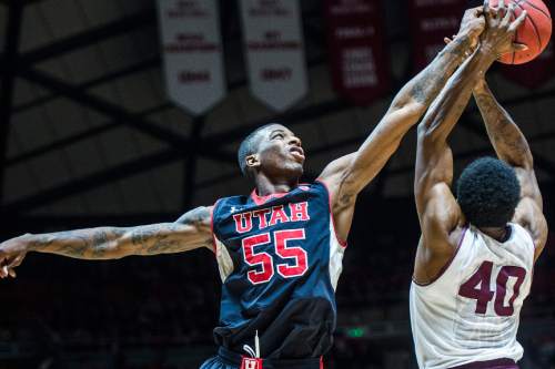 Chris Detrick  |  The Salt Lake Tribune
Utah Utes guard Delon Wright (55) and Arizona State Sun Devils guard Shaquielle McKissic (40) go for a rebound during the game at the Huntsman Center Thursday February 26, 2015.  Utah is winning 41-9 at halftime.