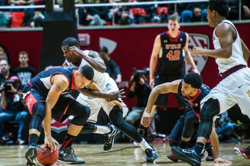 Chris Detrick  |  The Salt Lake Tribune
Utah Utes forward Jordan Loveridge (21) steals the ball from Arizona State Sun Devils guard Gerry Blakes (4) during the game at the Huntsman Center Thursday February 26, 2015.  Utah is winning 41-9 at halftime.