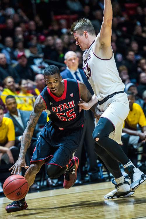 Chris Detrick  |  The Salt Lake Tribune
Utah Utes guard Delon Wright (55) runs around Arizona State Sun Devils guard Bo Barnes (33) during the game at the Huntsman Center Thursday February 26, 2015.  Utah is winning 41-9 at halftime.