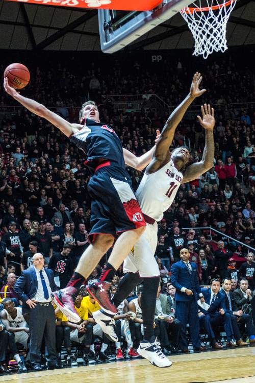 Chris Detrick  |  The Salt Lake Tribune
Utah Utes forward Jakob Poeltl (42) grabs a pass past Arizona State Sun Devils forward Savon Goodman (11) during the game at the Huntsman Center Thursday February 26, 2015.  Utah is winning 41-9 at halftime.