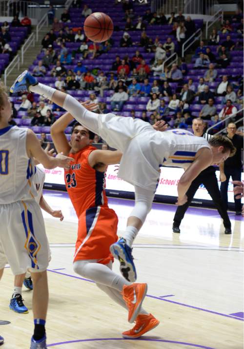 Francisco Kjolseth  |  The Salt Lake Tribune 
Timpview's Devin Kaufusi (32) collides with Orem's Hayden Young (3) in 4A boys' hoops quarterfinal at the Dee Events Center in Ogden on Thursday, Feb. 26, 2015.