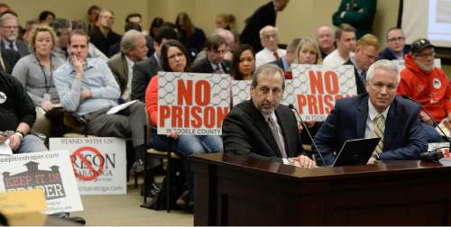Francisco Kjolseth  |  The Salt Lake Tribune 
Consultants Robert Nardi, left, and Brad Sassatelli give a report on the viability of prison locations which expanded to five during a packed Prison Relocation Commission meeting at the Utah Capitol on Friday, Feb. 27, 2015.