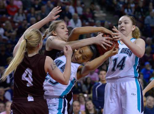 Leah Hogsten  |  The Salt Lake Tribune
Juan Diego's Dominique Mills battles Morgan for the ball. Juan Diego High School girls basketball team defeated Morgan High School 67-47 to win the 3A State Championship game, Saturday, February 28, 2015 at the Maverick Center.
