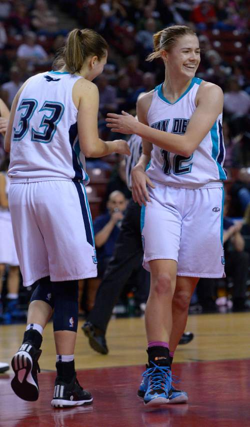 Leah Hogsten  |  The Salt Lake Tribune
Juan Diego's Becca Curran and Brynn Drummond are smiles at the end of the game. Juan Diego High School girls basketball team defeated Morgan High School 67-47 to win the 3A State Championship game, Saturday, February 28, 2015 at the Maverick Center.