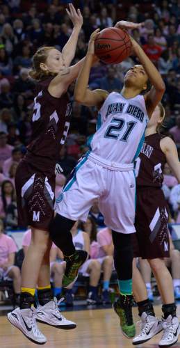 Leah Hogsten  |  The Salt Lake Tribune
Juan Diego's Monique Mills is fouled by Morgan's Lily Henry.  Juan Diego High School girls basketball team leads Morgan High School 26-17 at the half during their 3A State Championship game, Saturday, February 28, 2015 at the Maverick Center.